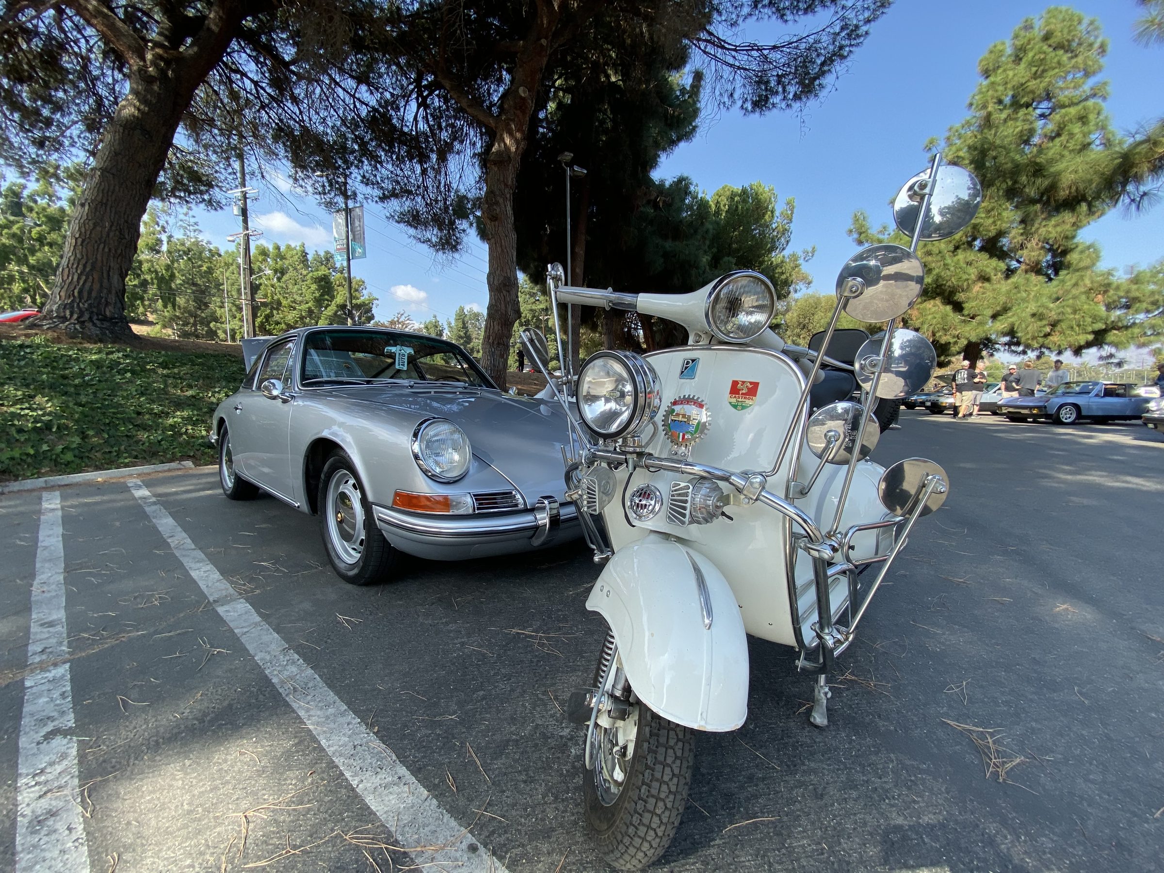 Vespa and ElectroPorsche at a car show